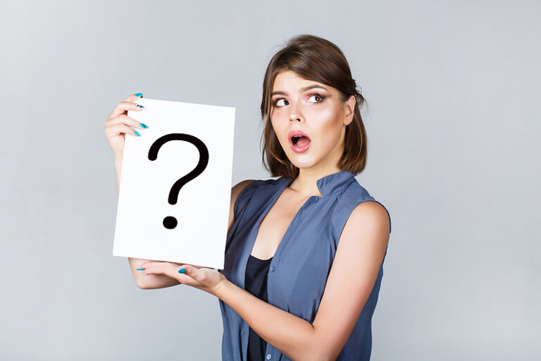 Girl Question. Woman With Doubtful Expression And Question Marks