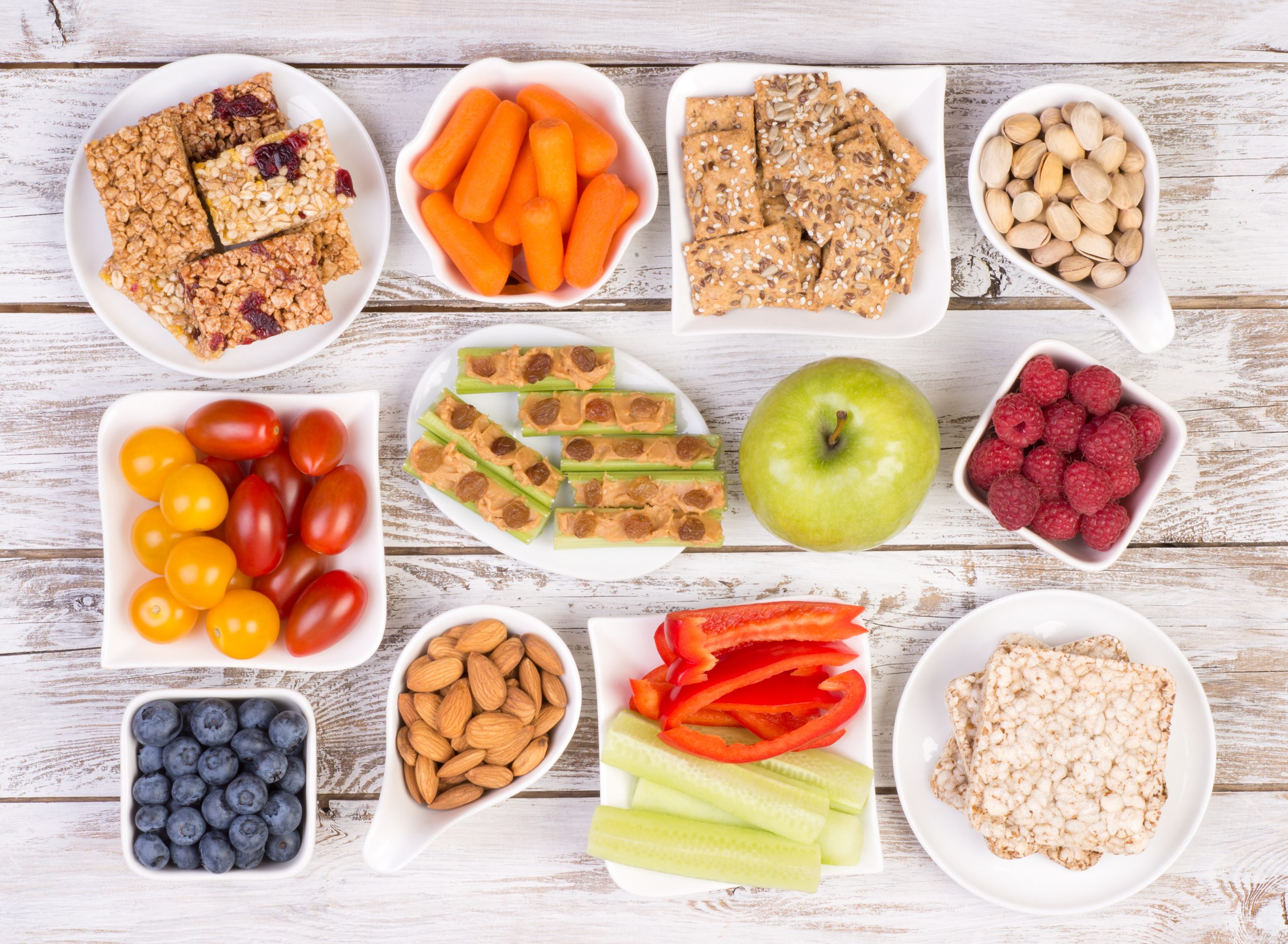 Healthy snacks on wooden table, top view How Diet Affects Your Oral Health Best Dentist in NW Calgary